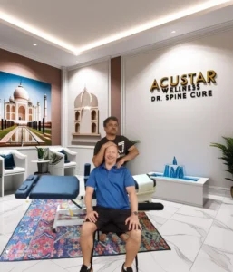 Dr. Rudresh treating patient at AcuSTAR Wellness - Best Chiropractic Clinic in Bangalore