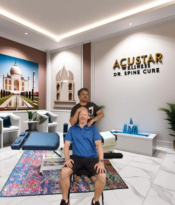 Dr. Rudresh treating patient at AcuSTAR Wellness - Best Chiropractic Clinic in Bangalore